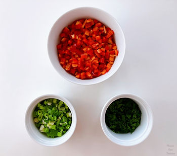 Paprika, spring onion, and parsley in a bowl