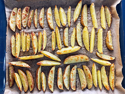 Cooking sheet and french fries on a baking sheet