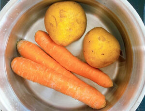 Water, potatoes, and carrots in a pot