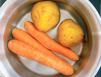 Water, potatoes, and carrots in a pot