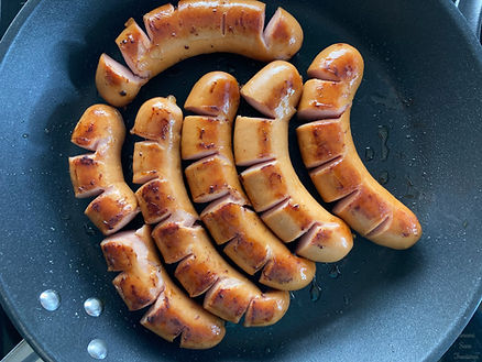 grilled sausage on a frying pan