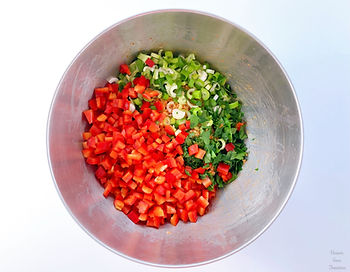 Paprika, spring onion, and parsley in a bowl