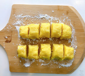Potato dough and potato starch on a wooden board