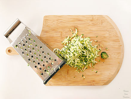 Zucchini on a wooden board, slicer