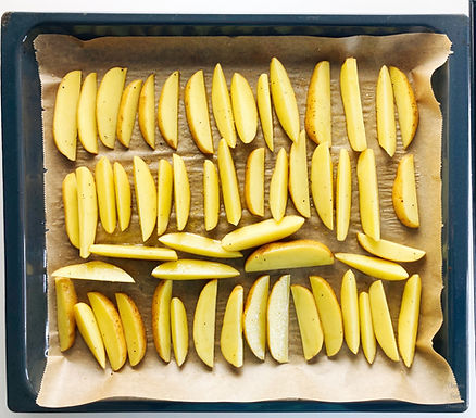 Cooking sheet and potatoes on a baking sheet