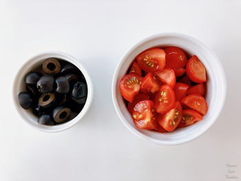 Black olives and cherry tomatoes in a container