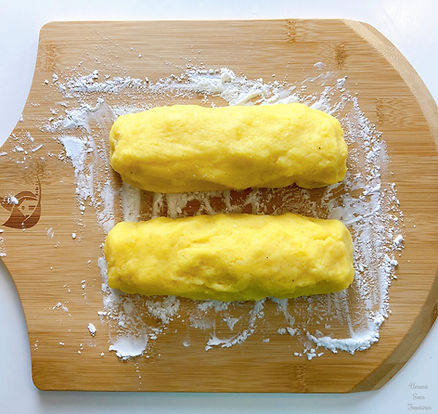 Potato dough and potato starch on a wooden board