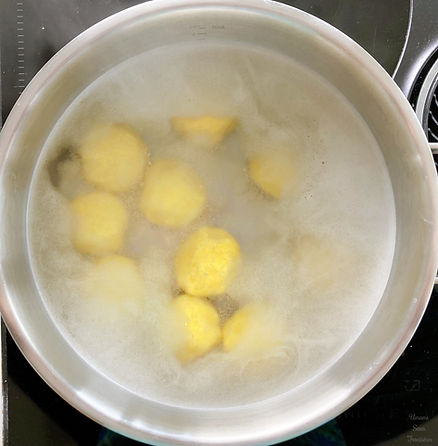 Hot water in a pot, potato dumplings