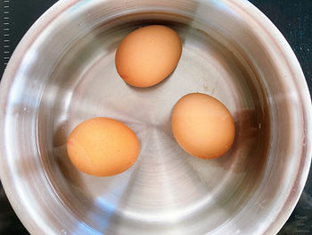 water and eggs in a pot