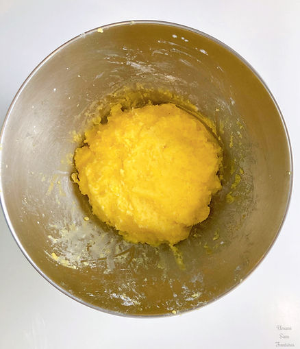 Potatoes, butter, egg yolks, potato starch, salt, and nutmeg in a bowl