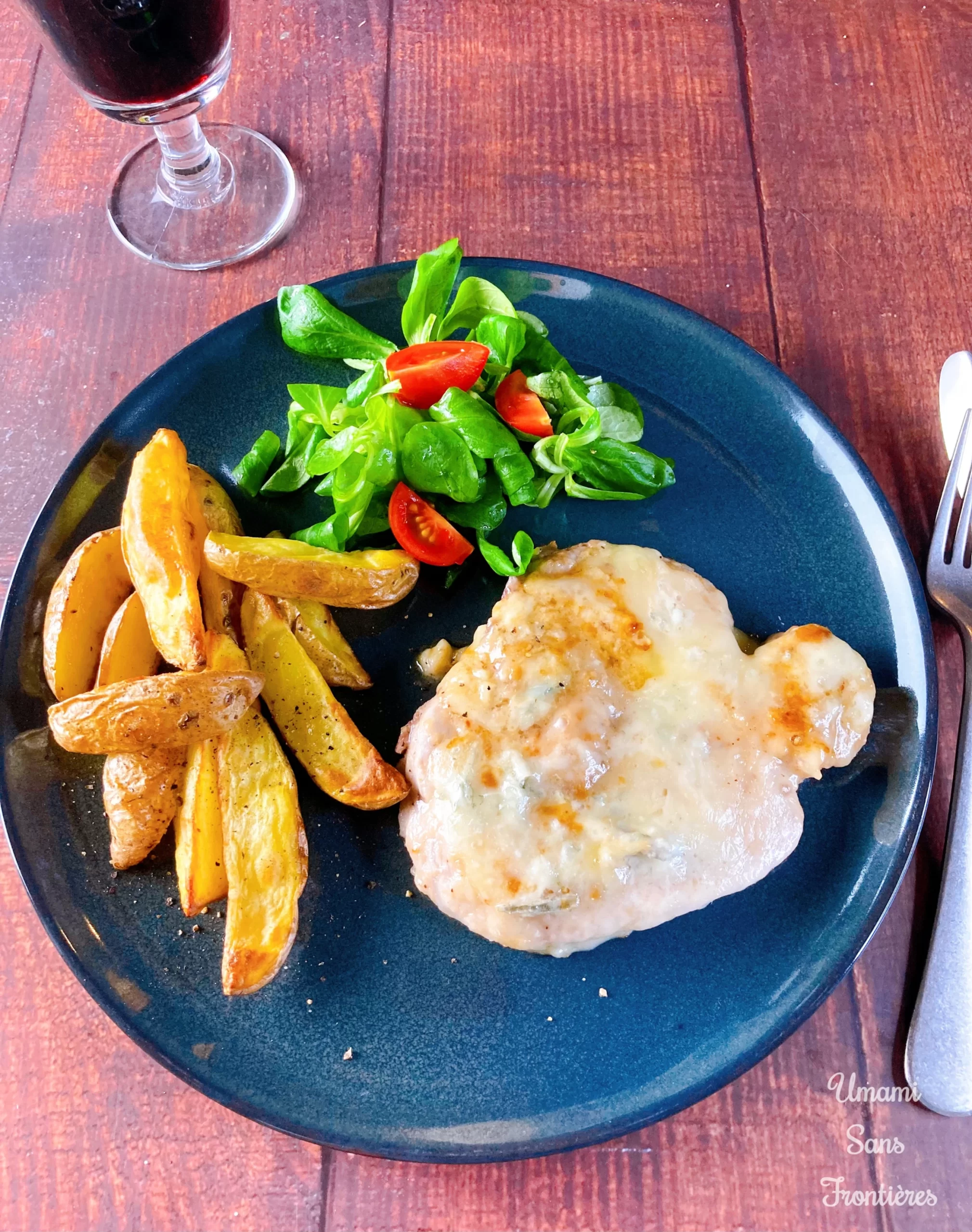 pork steak with gorgonzola cheese sauce served paired with red wine