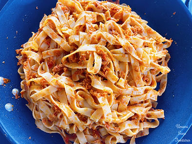 Pasta in a frying pan, pestosso with sun-dried tomatoes