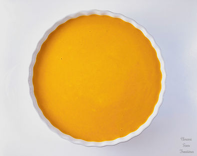 Biscuit dough and pumpkin cream in a heat-resistant dish