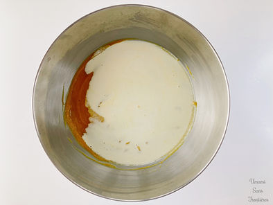 Pumpkin dough and fresh cream in a bowl