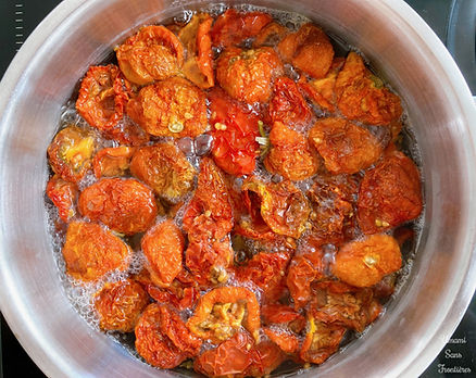 Sun-dried tomatoes and vinegar in a pot