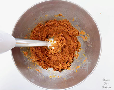 Sun-dried tomato paste in a bowl, hand blender