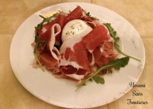 appetizer of arugula prosciutto and mozzarella