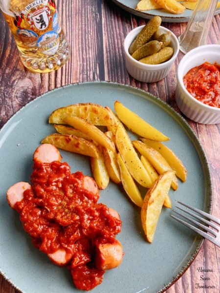 Currywurst with fried potatoes