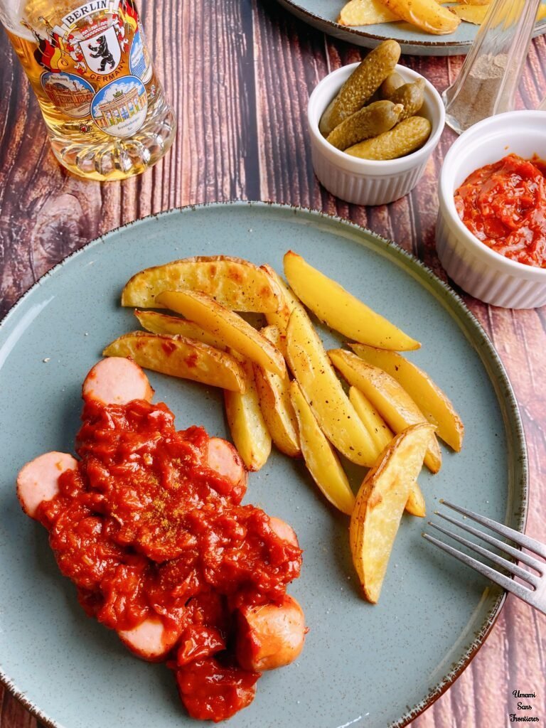 Currywurst with fried potatoes 