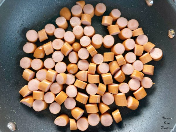 Linsensuppe cut sausages in a frying pan