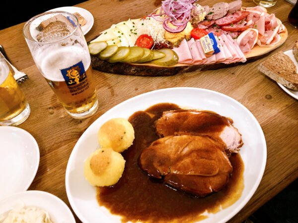 crispy roast pork (shoulder) oven-baked with dark beer sauce potato dumplings