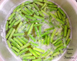 Pasta Pesto potatoes and green beans boiled water in a pot