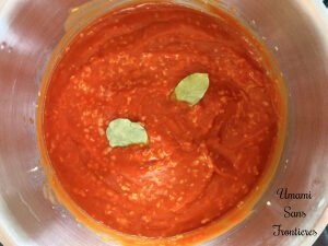 Solyanka onion tomato puree bay leaves in a pot