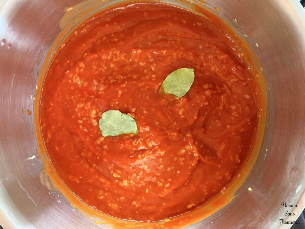 Solyanka onion tomato puree bay leaves in a pot