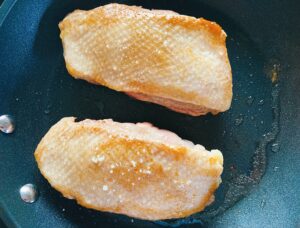 Magret de canard duck breasts in a fry pan