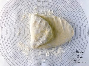 Pizza Quattro Formaggi dough folded one side toward the center