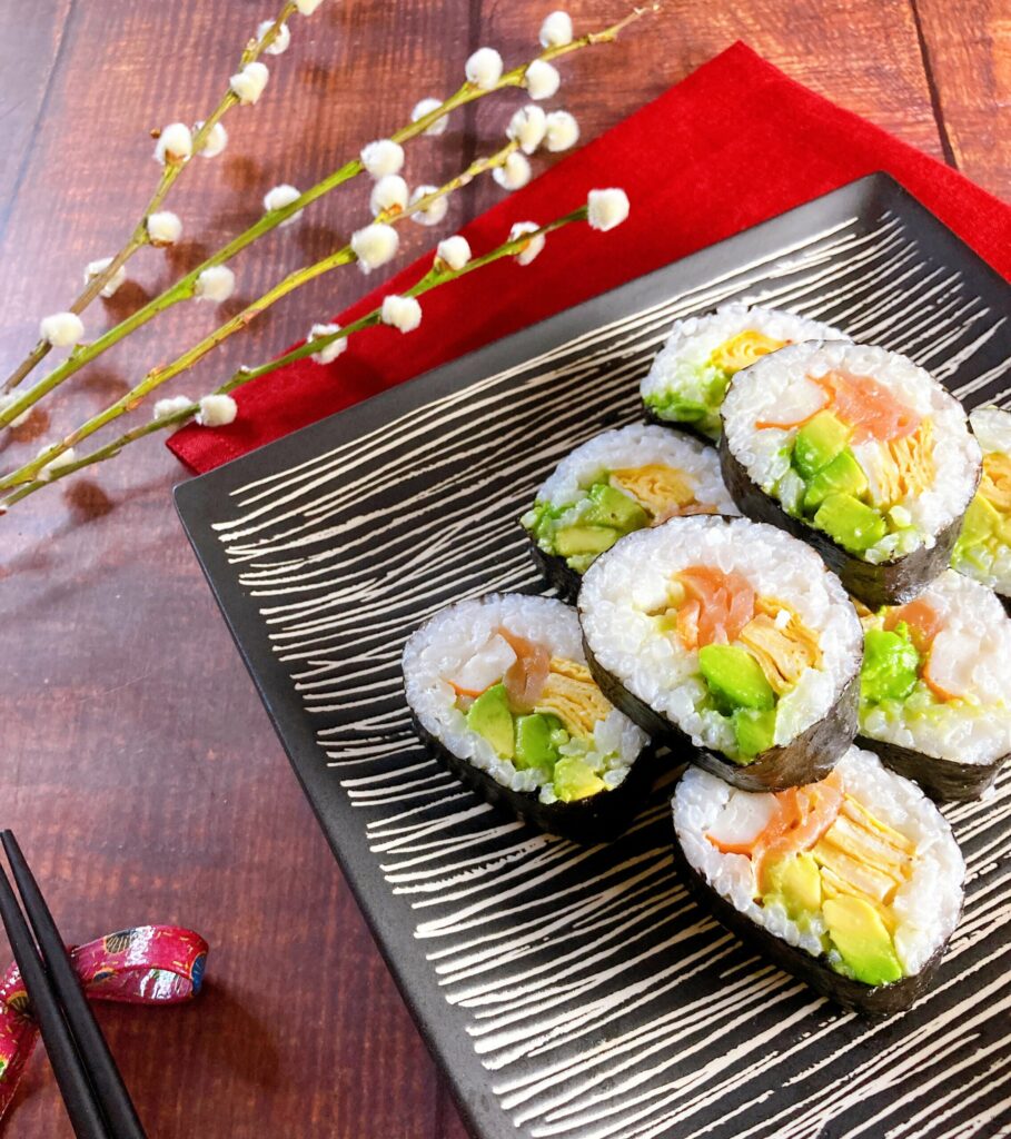 Sushi Rolls with Crab Stick, Salmon, and Avocado