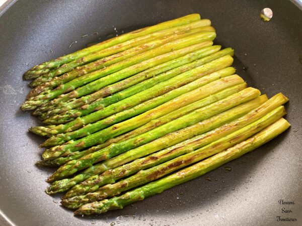 Asparagus grilled in fly pan added salt and pepper