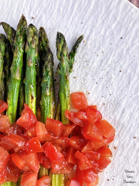 Up photo with asparagus and tomatoes
