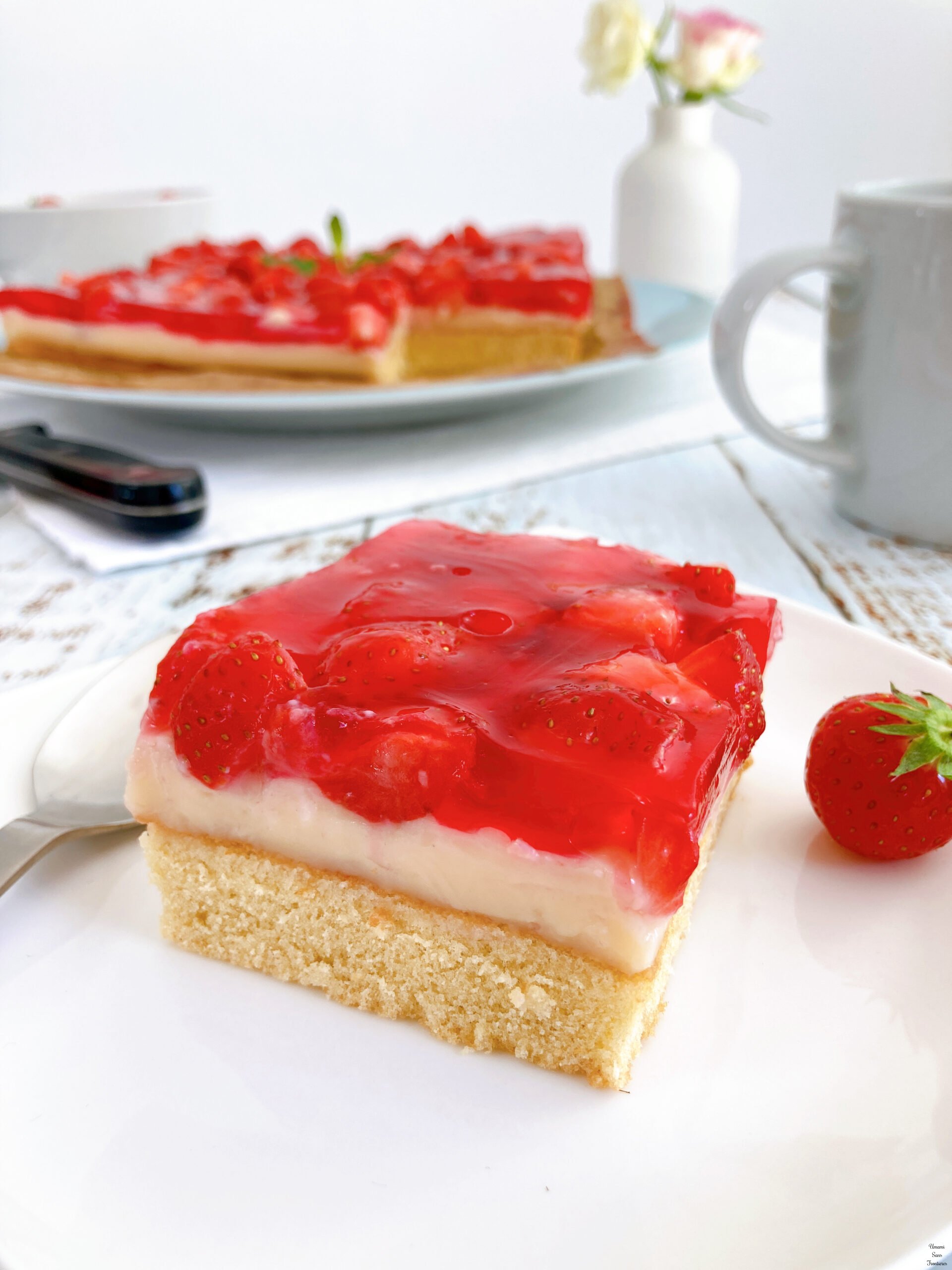 German strawberry cake cup a strawberry spoon