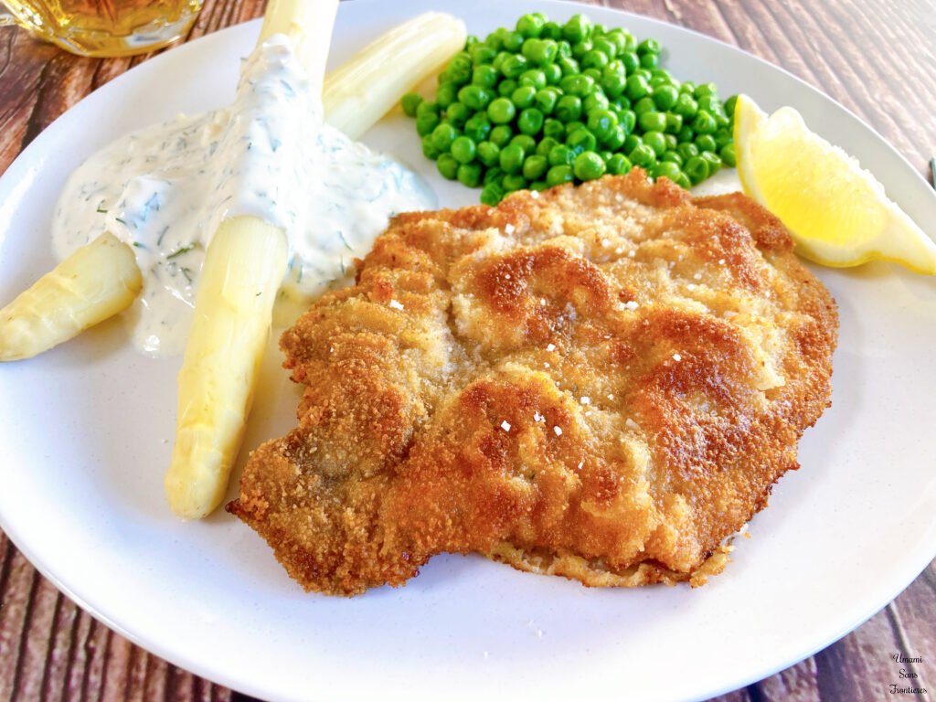 Schnitzel lemon green peas asparagus yogourt sauce