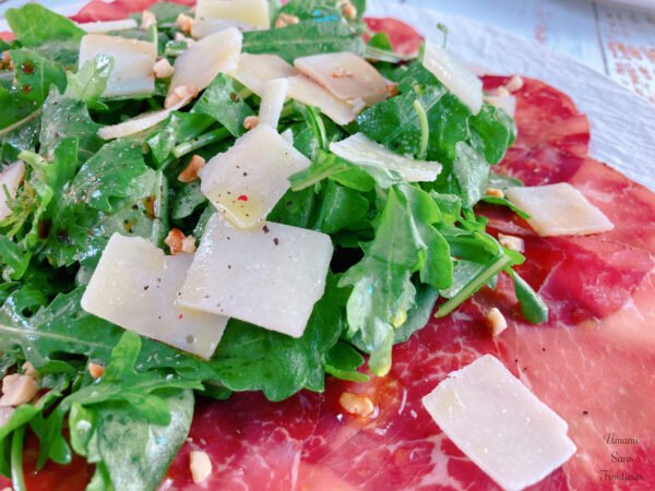 Arugula, and Grana Padano.sliced beef bresaola pepper nuts