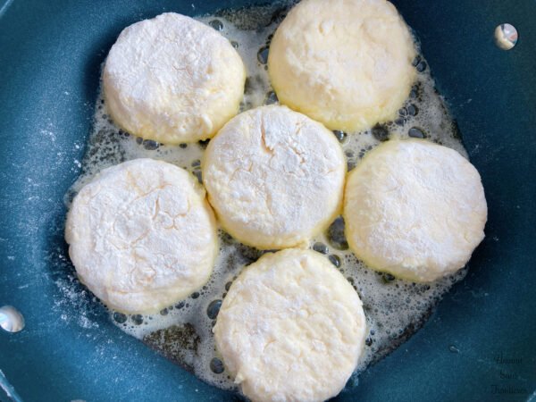 Syrniki butter in frypan