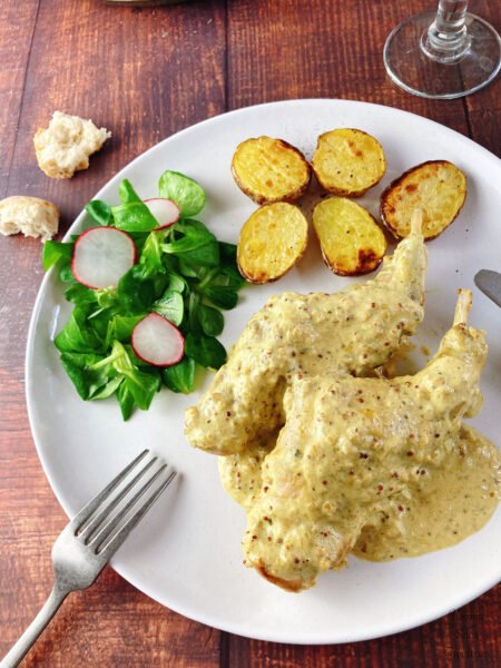Rabbit / Chicken Breast in Mustard Cream Sauce baked potatoes salad bread fork