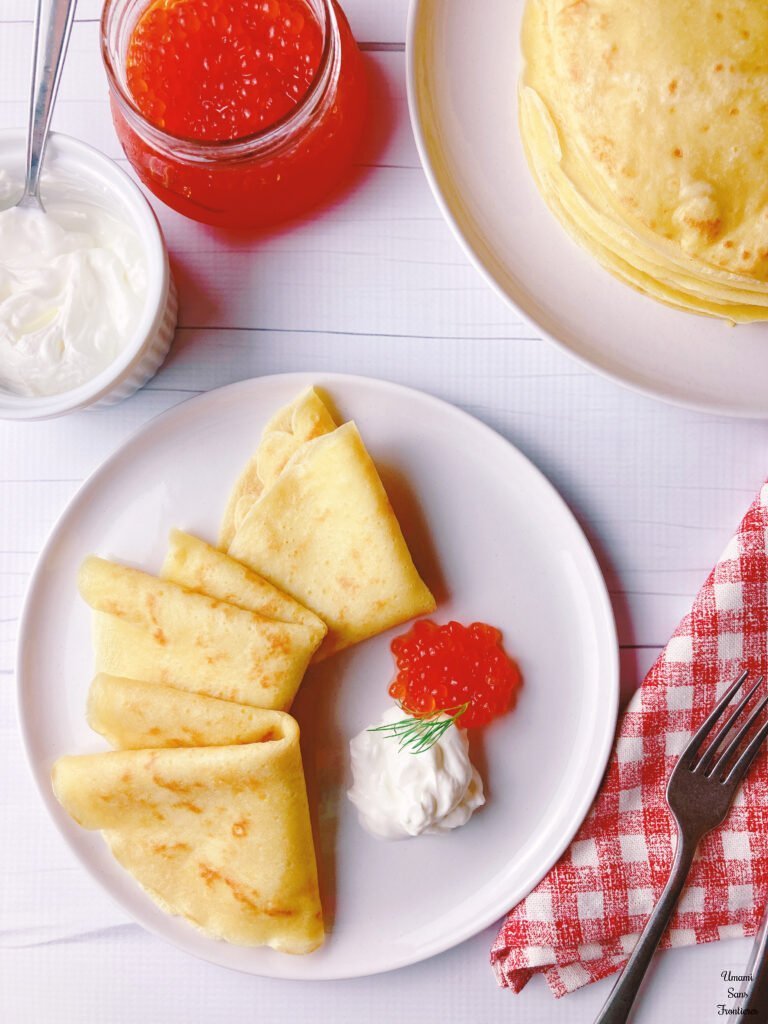 Russian blini fork caviar sour cream napkin