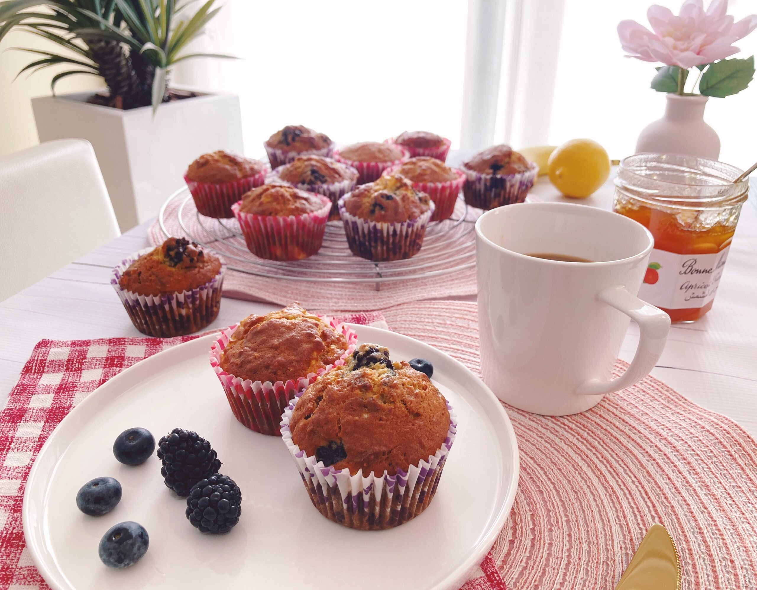 Two muffins berries coffee jam flower plante