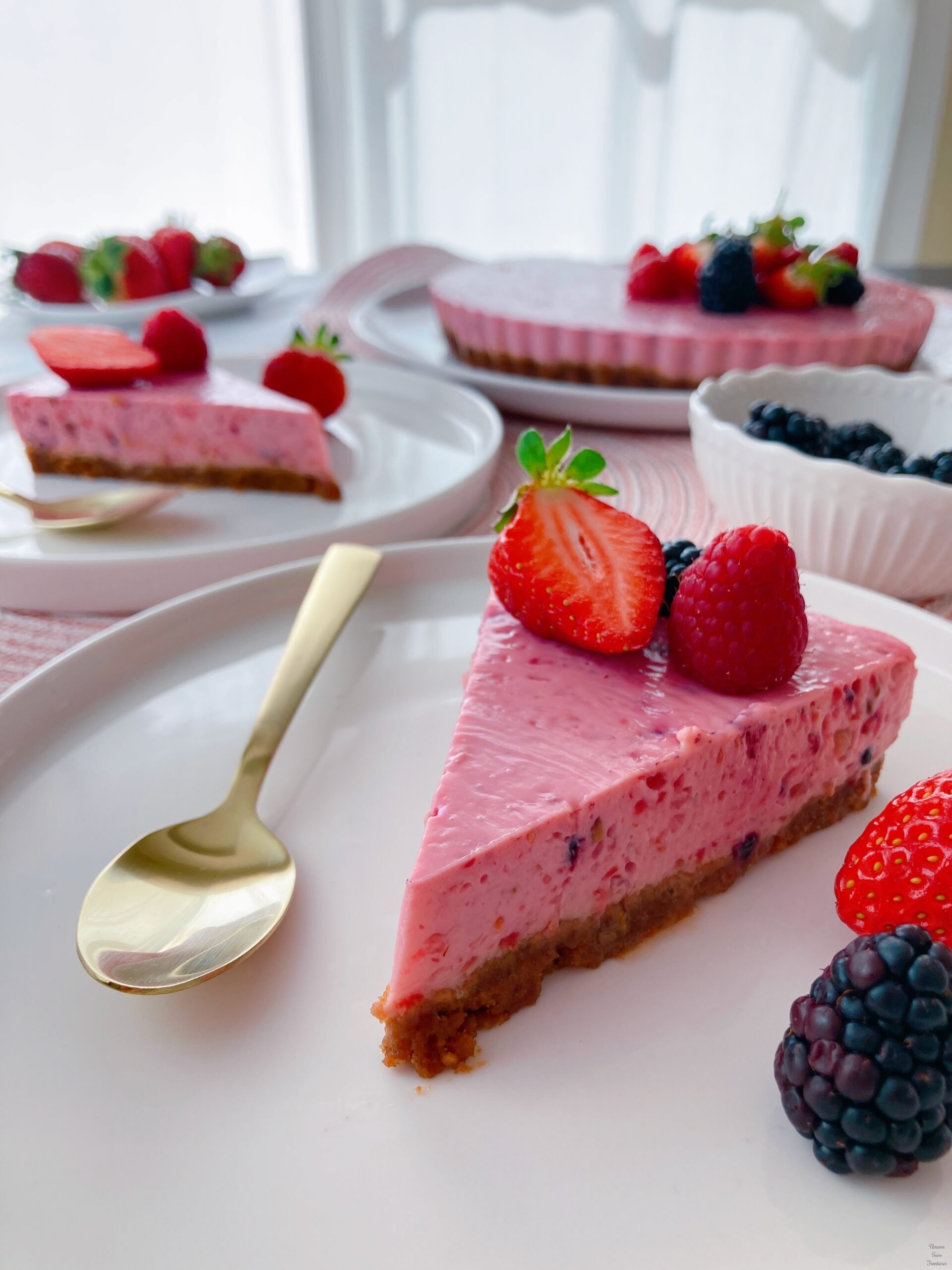Piece of strawberry and berry cheese cake spoon