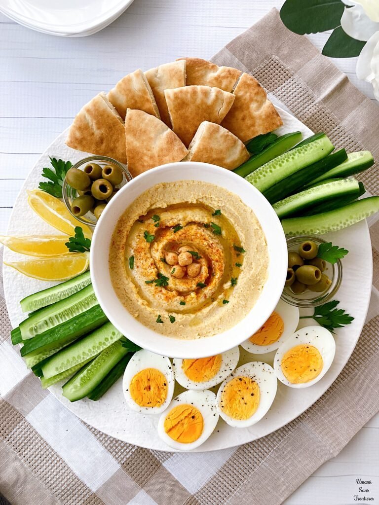hummus cucumbers Arabian bread lemon boiled eggs plate flower