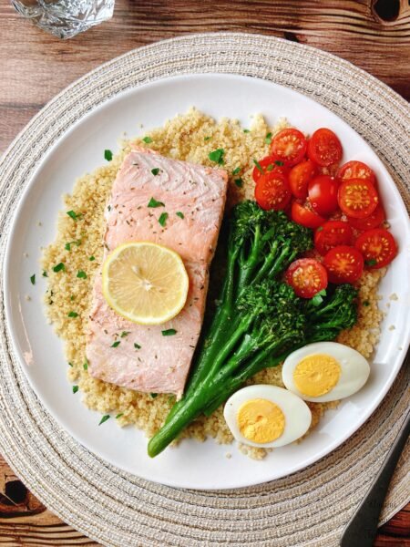 poached salmon tomates broccolini boiled eggs quinoa parsley