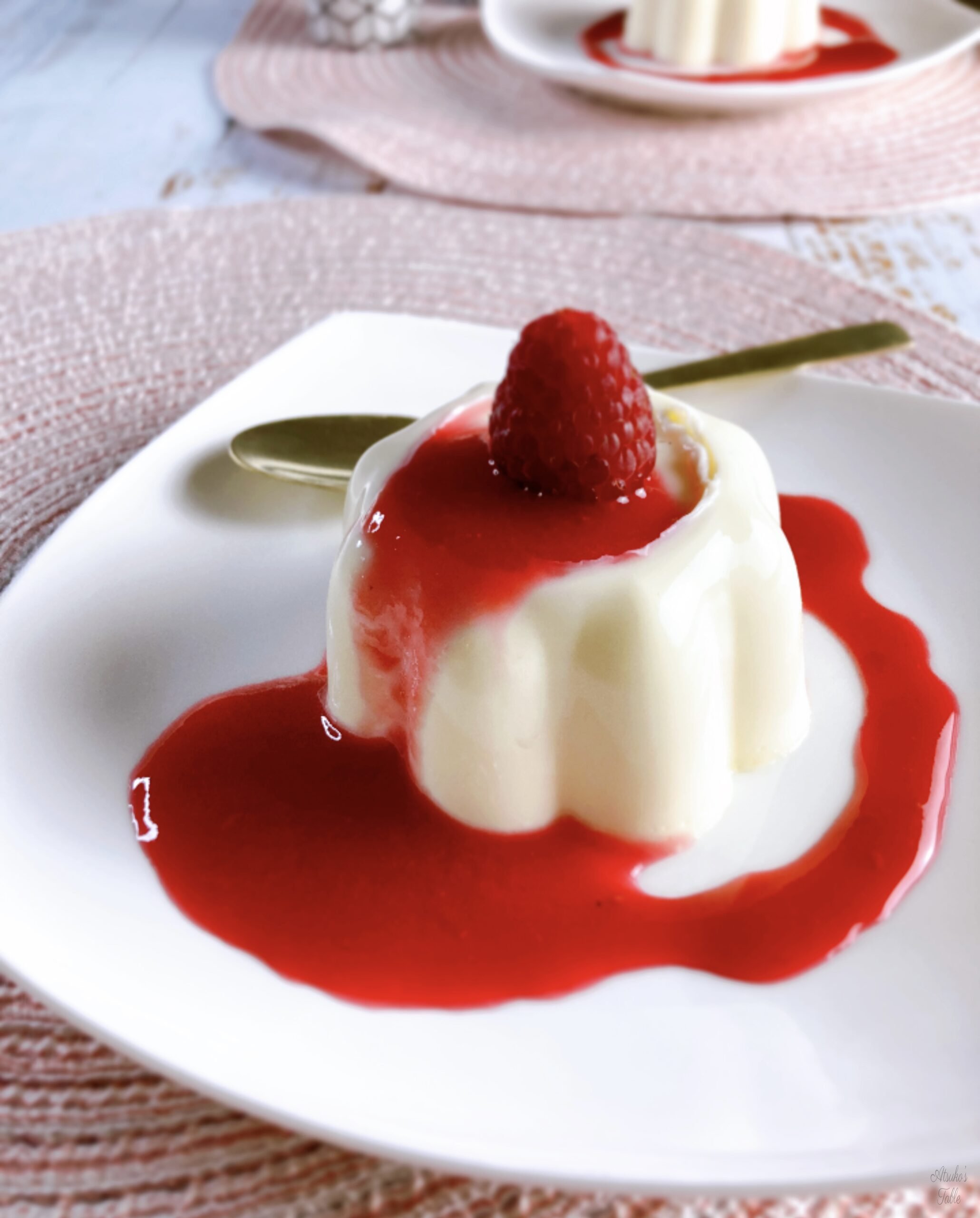 panna cotta with raspberry sauce spoon