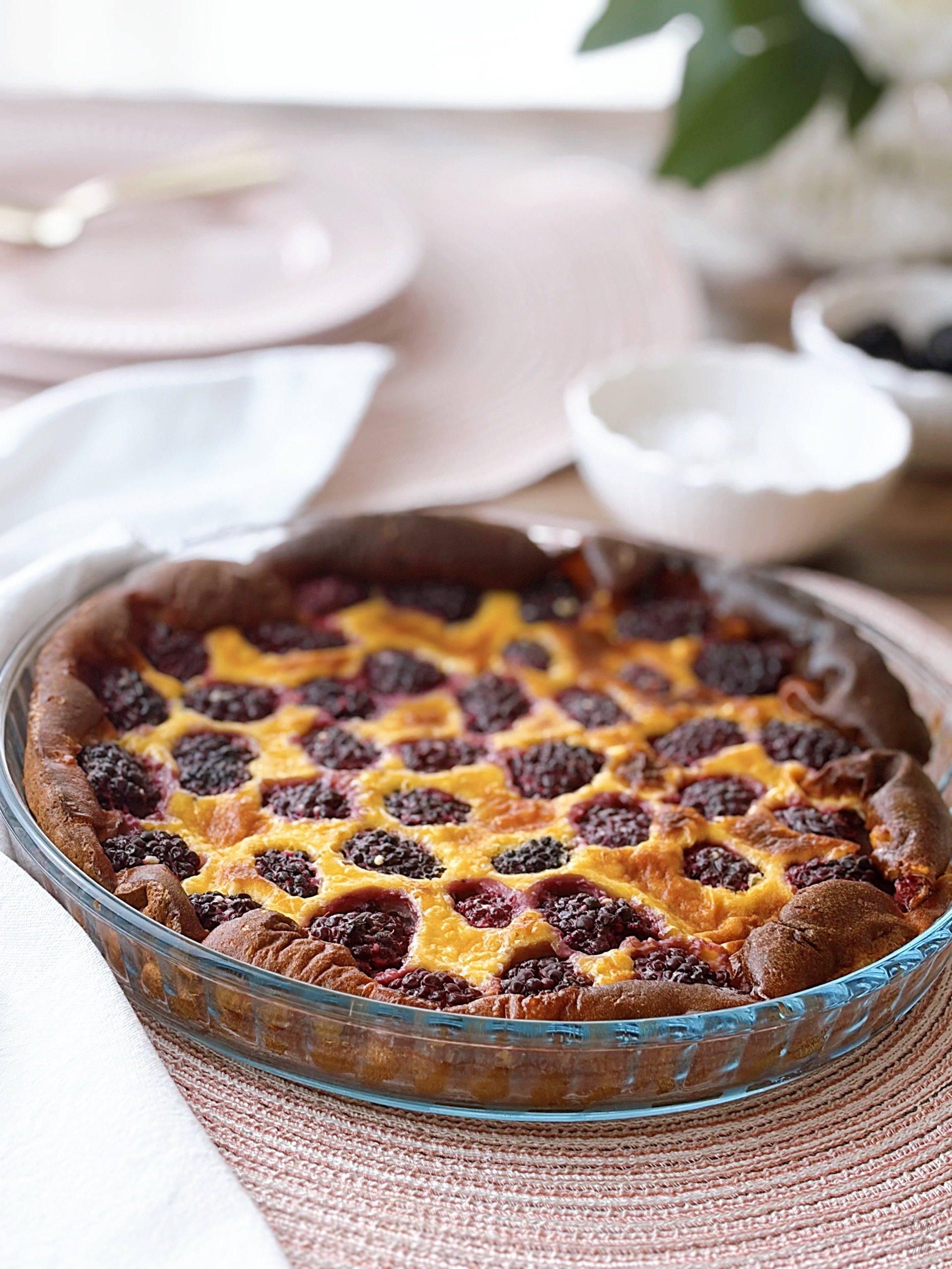 blackberry clafoutis icing sugar flower plates