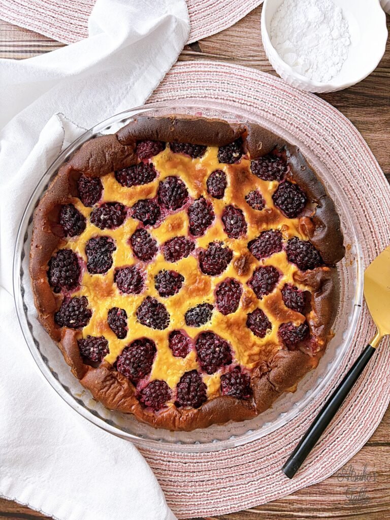 blackberry clafoutis icing sugar