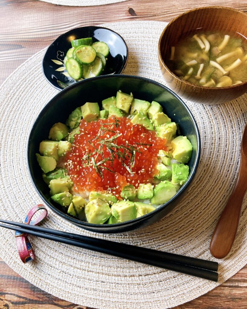 Salmon Roe & Avocado Rice Bowl miso soup cucumber chopsticks wood spoon