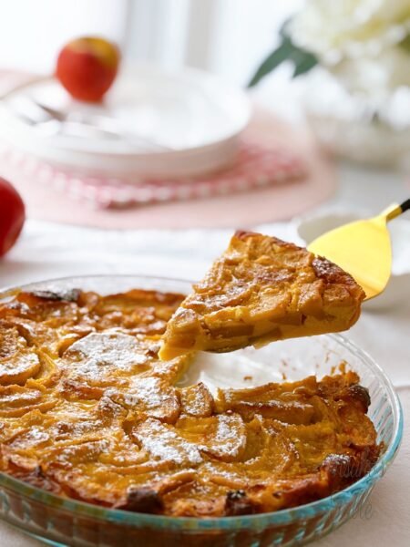 a piece of french apple cake cake server